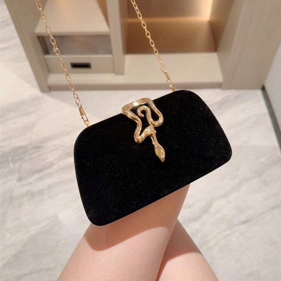 Elegant Black Clutch with Gold Accent